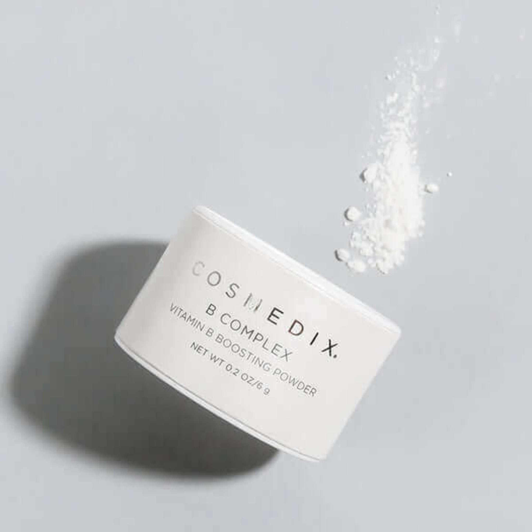 Cosmedix B Complex powder jar on a light gray background