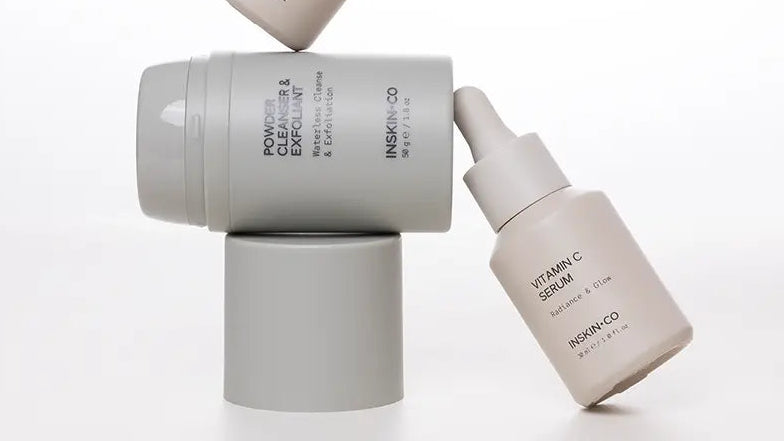Three skincare bottles from Insight Co. on a white background
